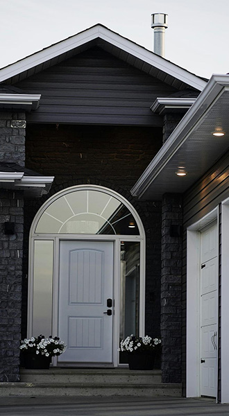 Clean Cut Siding crew installing vinyl siding on a Waterloo Region home