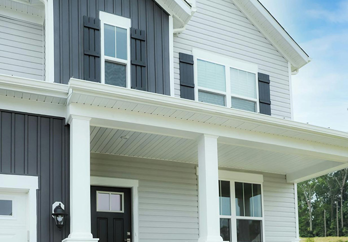 Clean Cut Siding Inc. crew completing an exterior siding project
